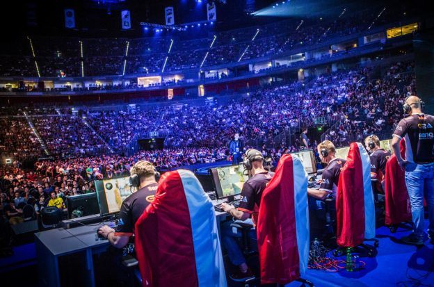 eSports players participate in a live competition in front of an audience