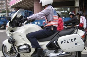 A police officer in Taiwan on a motorcycle