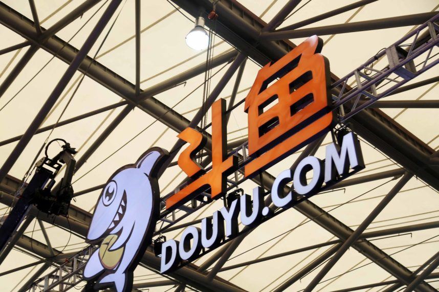 A sign for Chinese streaming platform DouYu installed in a stadium
