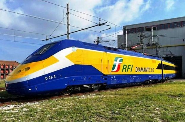 A train operated by RFI in Italy pulls out of a maintenance shed