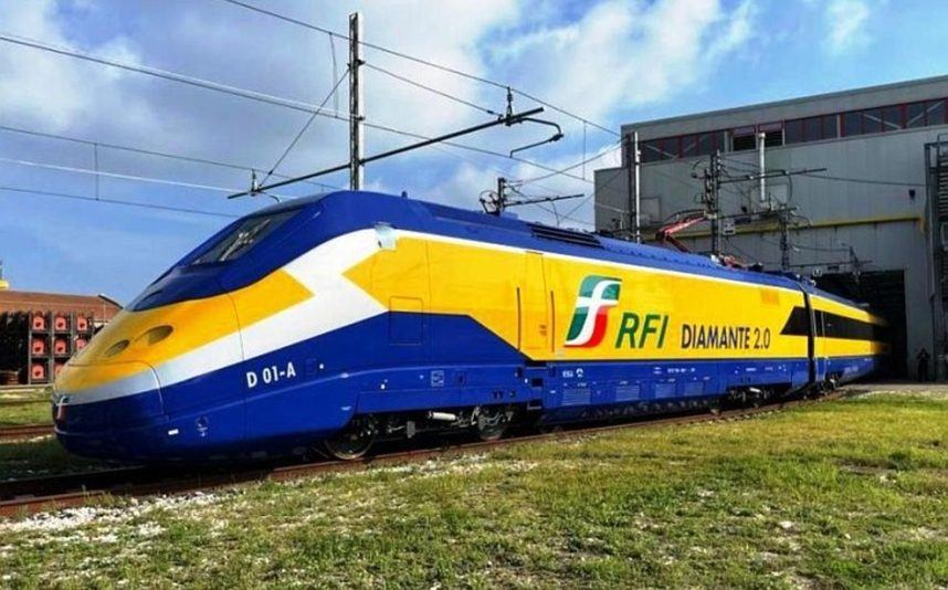 A train operated by RFI in Italy pulls out of a maintenance shed.