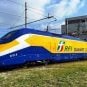 A train operated by RFI in Italy pulls out of a maintenance shed