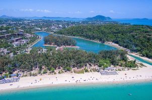 An aerial view of Nai Harn Bay and beach