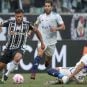 Atlético Mineiro striker Givanildo Vieira de Sousa handles the ball against Cruzeiro players