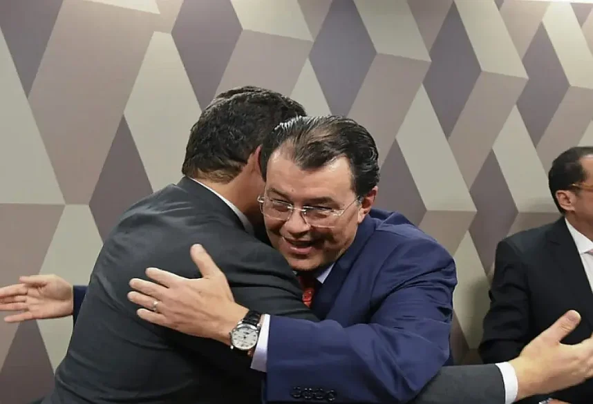 Brazilian Senator Eduardo Braga and another Senator celebrate legislative efforts