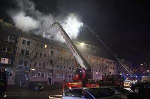 Firefighters work to extinguish a fire in Dortmund, Germany