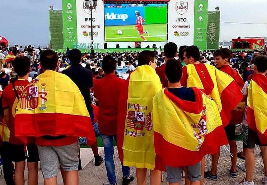 Spaniards wearing flags while watching Spain in the World Cup