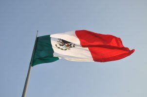The Mexican flag flying from a pole