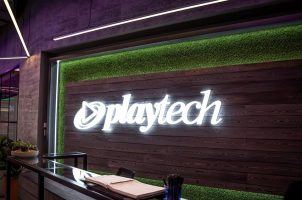 The Playtech logo behind a desk in the company's office