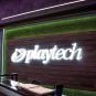 The Playtech logo behind a desk in the company's office