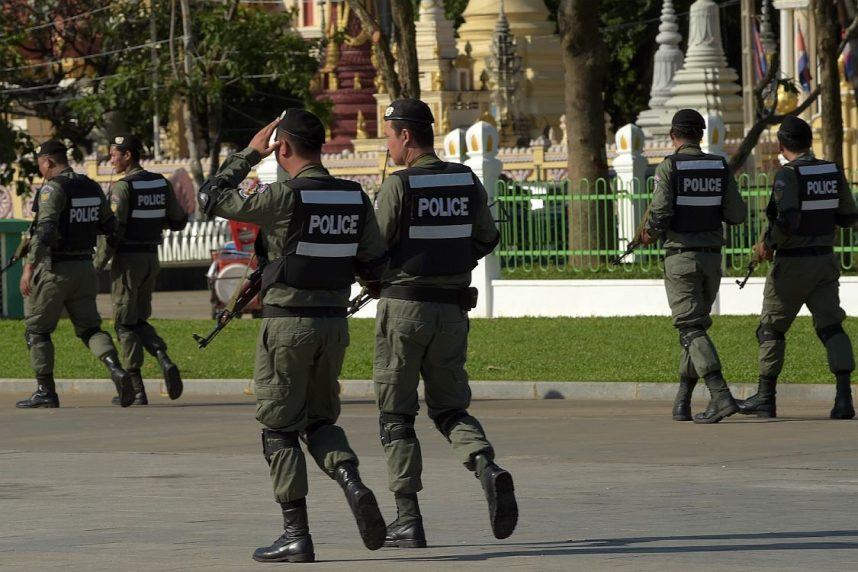 Well-armed Cambodian police officers on patrol