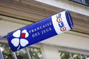 A sign for French gaming and lottery operator Française des Jeux outside a store