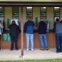 Bettors place wagers on races through TAB betting kiosks in Australia