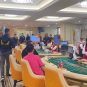 Police officers conduct a raid of an illegal casino in Thailand