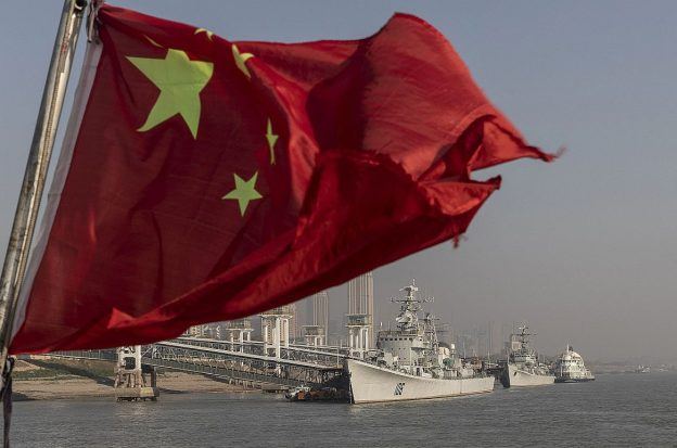 The Chinese flag flying from a ship