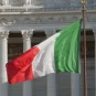 The Italian flag in front of the Victor Emmanuel II National Monument in Rome