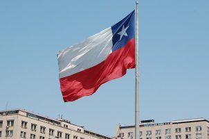 The flag of Chile flying on a flagpole