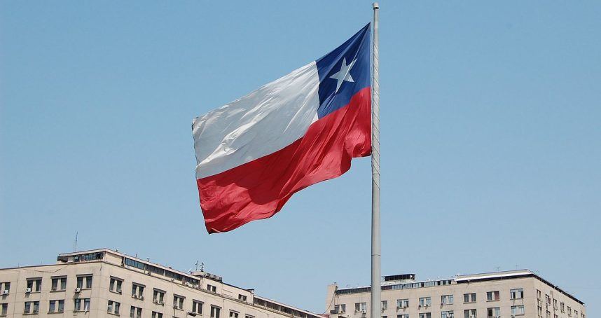 The flag of Chile flying on a flagpole