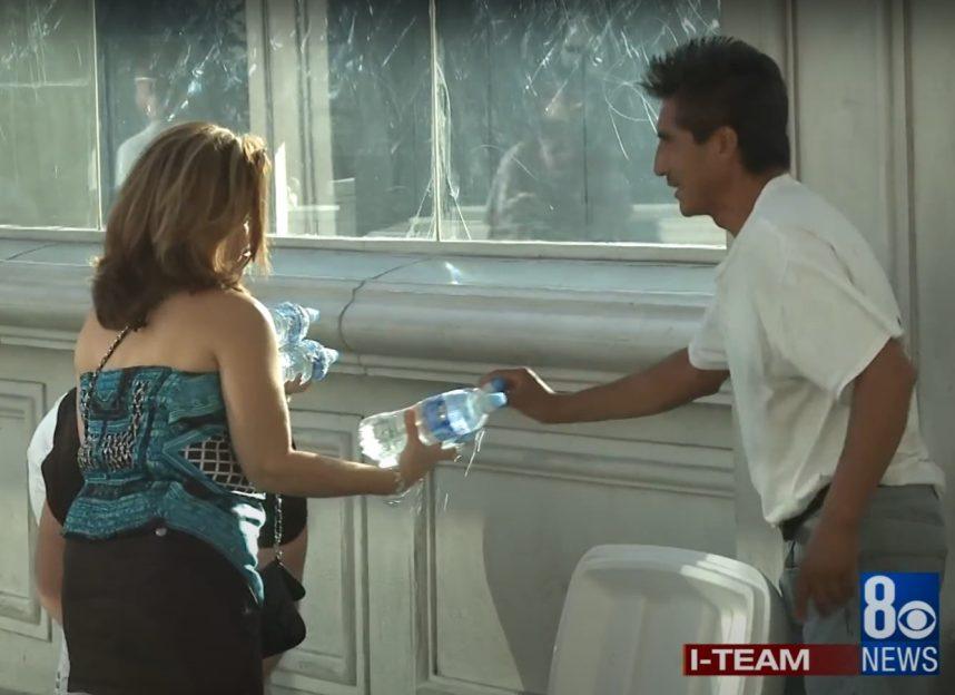 An illegal vendor sells three water bottles 