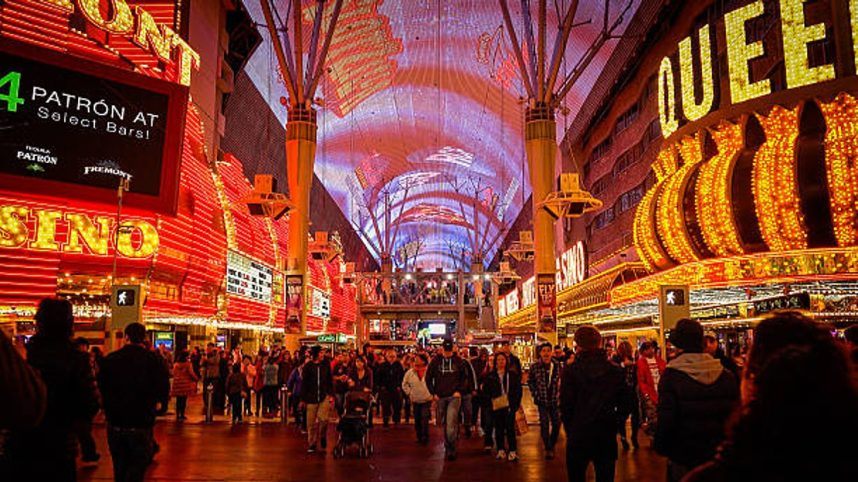 Pedestrians cross N. 3rd Street beneath the Fremont Street Experience canopy