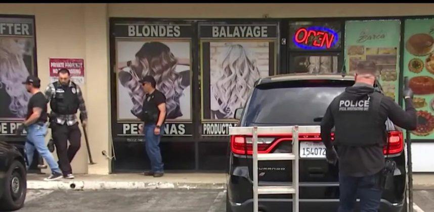 Police officers at the raid of a California beauty salon