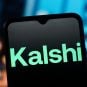 Kalshi word mark on a black background on a phone