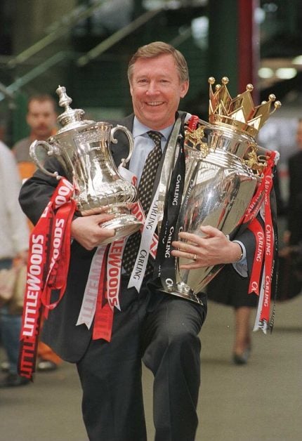 Sir Alex Ferguson, the last hreat United manager, juggling trophies in 1996. (Image: Getty)