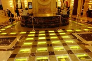 Macau casinos, Grand Emperor Hotel, satellite casinos, gold prices, casino closures, gold walkway