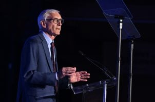 Wisconsin Gov. Tony Evers speaks during the Wisconsin Democrats 2025 Convention at Chula Vista Resort on June 14, 2025. Evers has signed tribal online sports betting into law, but he has demands before he'll sign amended Class III gaming compacts. (Image: Getty)