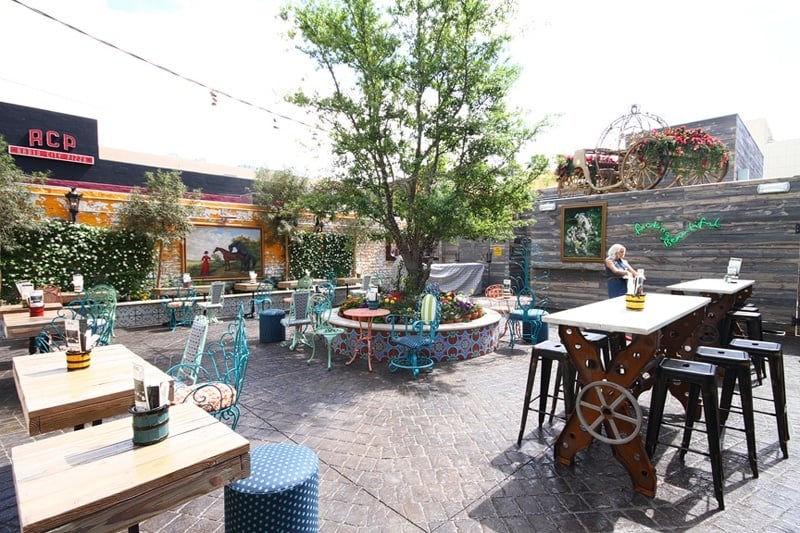The outdoor seating will charm your pants off. In the summer heat, it'll charm your make-up off.