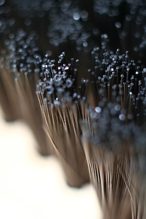Felt brush bristles are made of nylon, a family of synthetic polymers known as aliphatic polyamides. Yes, we knew that off the top of our head, thanks.